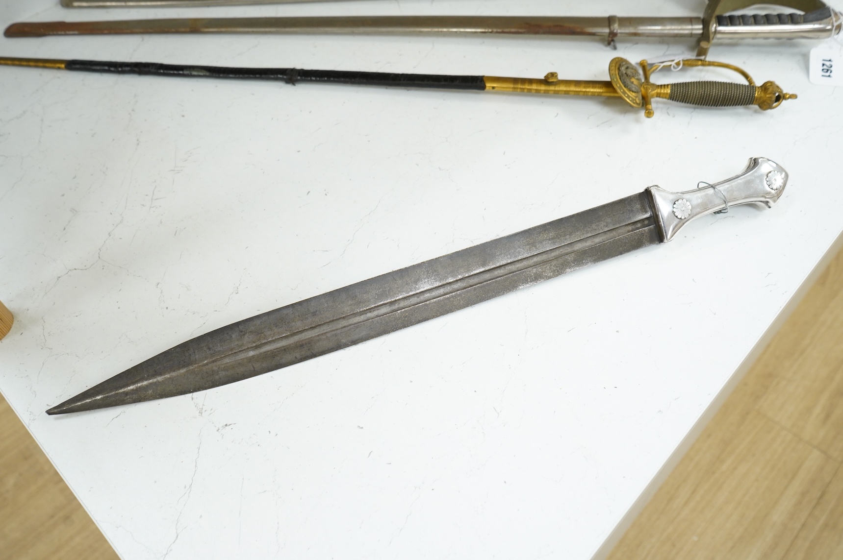 A late 19th century Ottoman Turkish dagger kindjal, blade 49cm, plain silver handle with decorative rivet heads